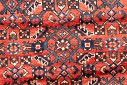 Full view of 1975s Hoseinabad rug from Iran / Persia, 305 × 78 cm in Red tones