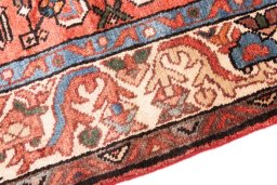 Backside of handmade 1997s Hoseinabad rug showing knot structure and weave density