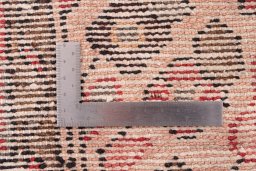 Close-up detail of 1970s Hoseinabad rug from Iran / Persia showing Wool weave