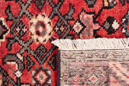 Close-up detail of 1970s Hoseinabad rug from Iran / Persia showing Wool weave