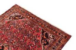 Surface texture of 1970s Hoseinabad rug with natural Wool and intricate pattern