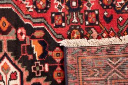 Close-up detail of 1970s Hoseinabad rug from Iran / Persia showing Wool weave