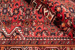 Corner detail of 1970s Hoseinabad rug showing border pattern and Wool pile