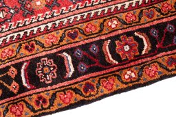 Backside of handmade 1980s Hoseinabad rug showing knot structure and weave density