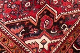 Close-up detail of 1980s Hoseinabad rug from Iran / Persia showing Wool weave