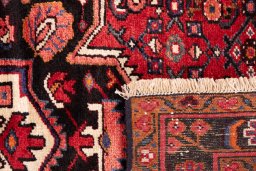 Full view of 1980s Hoseinabad rug from Iran / Persia, 217 × 152 cm in Red tones
