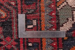 Close-up detail of 1988s Hoseinabad rug from Iran / Persia showing Wool weave