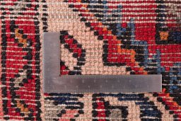 Close-up detail of 1988s Hoseinabad rug from Iran / Persia showing Wool weave