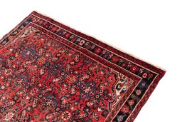 Surface texture of 1988s Hoseinabad rug with natural Wool and intricate pattern