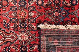 Close-up detail of 1988s Hoseinabad rug from Iran / Persia showing Wool weave