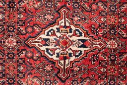 Full view of 1988s Hoseinabad rug from Iran / Persia, 248 × 150 cm in Terracotta tones