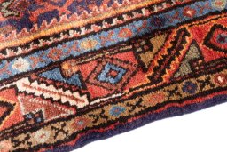 Backside of handmade 1974s Hoseinabad rug showing knot structure and weave density