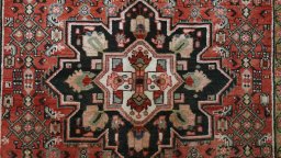 Close-up detail of 1990s Hoseinabad rug from Iran / Persia showing Wool weave