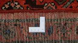 Corner detail of 2000s Hoseinabad rug showing border pattern and Wool pile
