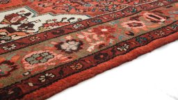 Central medallion detail of 2000s Hoseinabad rug from Iran / Persia