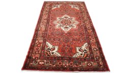 Full view of 2000s Hoseinabad rug from Iran / Persia, 320 × 160 cm in Red tones