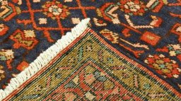 Close-up detail of 2000s Hoseinabad rug from Iran / Persia showing Wool weave
