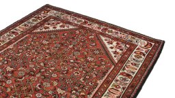 Surface texture of 2000s Hoseinabad rug with natural Wool and intricate pattern