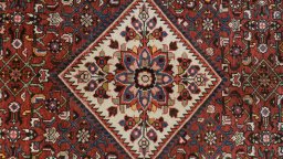 Central medallion detail of 2000s Hoseinabad rug from Iran / Persia