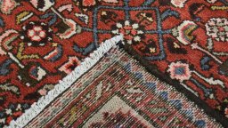 Close-up detail of 2000s Hoseinabad rug from Iran / Persia showing Wool weave