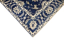 Backside of handmade 1980s Isfahan rug showing knot structure and weave density