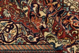 Corner detail of 1900s Isfahan rug showing border pattern and Wool pile