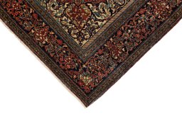 Backside of handmade 1900s Isfahan rug showing knot structure and weave density