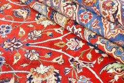 Full view of 1930s Isfahan rug from Iran / Persia, 702 × 411 cm in Red tones