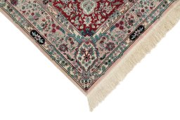 Backside of handmade New Isfahan rug showing knot structure and weave density