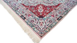 Backside of handmade New Isfahan rug showing knot structure and weave density