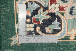 Corner detail of New Isfahan rug showing border pattern and Wool pile