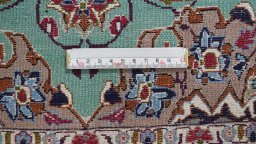 Backside of handmade 1990s Isfahan rug showing knot structure and weave density
