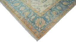 Backside of handmade New Isfahan rug showing knot structure and weave density