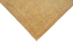 Backside of handmade New Isfahan rug showing knot structure and weave density