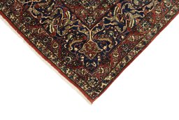 Backside of handmade 1920s Isfahan rug showing knot structure and weave density