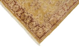 Backside of handmade New Isfahan rug showing knot structure and weave density