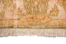 Backside of handmade New Isfahan rug showing knot structure and weave density