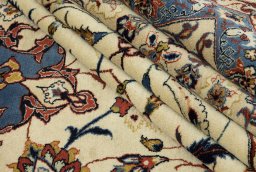 Full view of 1970s Isfahan rug from Iran / Persia, 440 × 320 cm in Cream tones