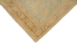 Backside of handmade New Isfahan rug showing knot structure and weave density