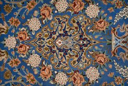 Close-up detail of 1990s Isfahan rug from Iran / Persia showing Silk weave