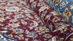 Close-up detail of 1990s Isfahan rug from Iran / Persia showing Wool weave