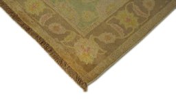 Backside of handmade New Isfahan rug showing knot structure and weave density