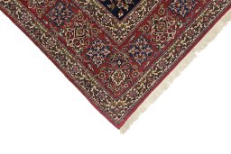 Backside of handmade 1930s Isfahan rug showing knot structure and weave density