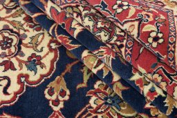 Full view of 1930s Isfahan rug from Iran / Persia, 419 × 312 cm in Dark blue tones