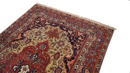 Surface texture of 1920s Isfahan rug with natural Wool and intricate pattern
