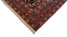 Backside of handmade 1920s Isfahan rug showing knot structure and weave density