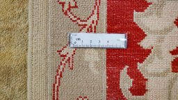 Corner detail of New Isfahan rug showing border pattern and Wool pile