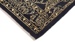 Backside of handmade New Isfahan rug showing knot structure and weave density