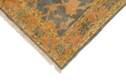 Backside of handmade New Isfahan rug showing knot structure and weave density