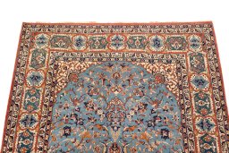 Surface texture of 1920s Isfahan rug with natural Wool and intricate pattern